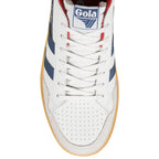 Close-up of a white Gola trainer with blue stripes, red lining, and white laces