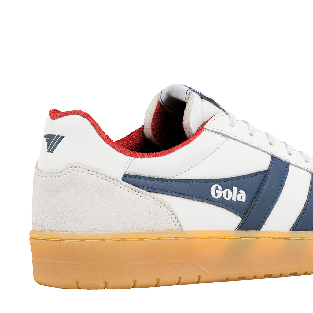 Close-up of the heel of a white Gola trainer with navy blue stripes and a red trim