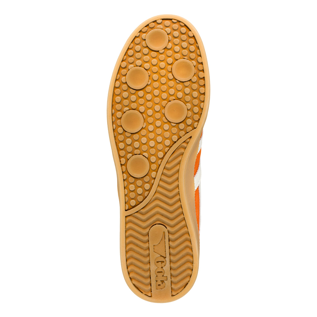 Gum rubber sole of a trainer with circular grip pattern and Gola branding