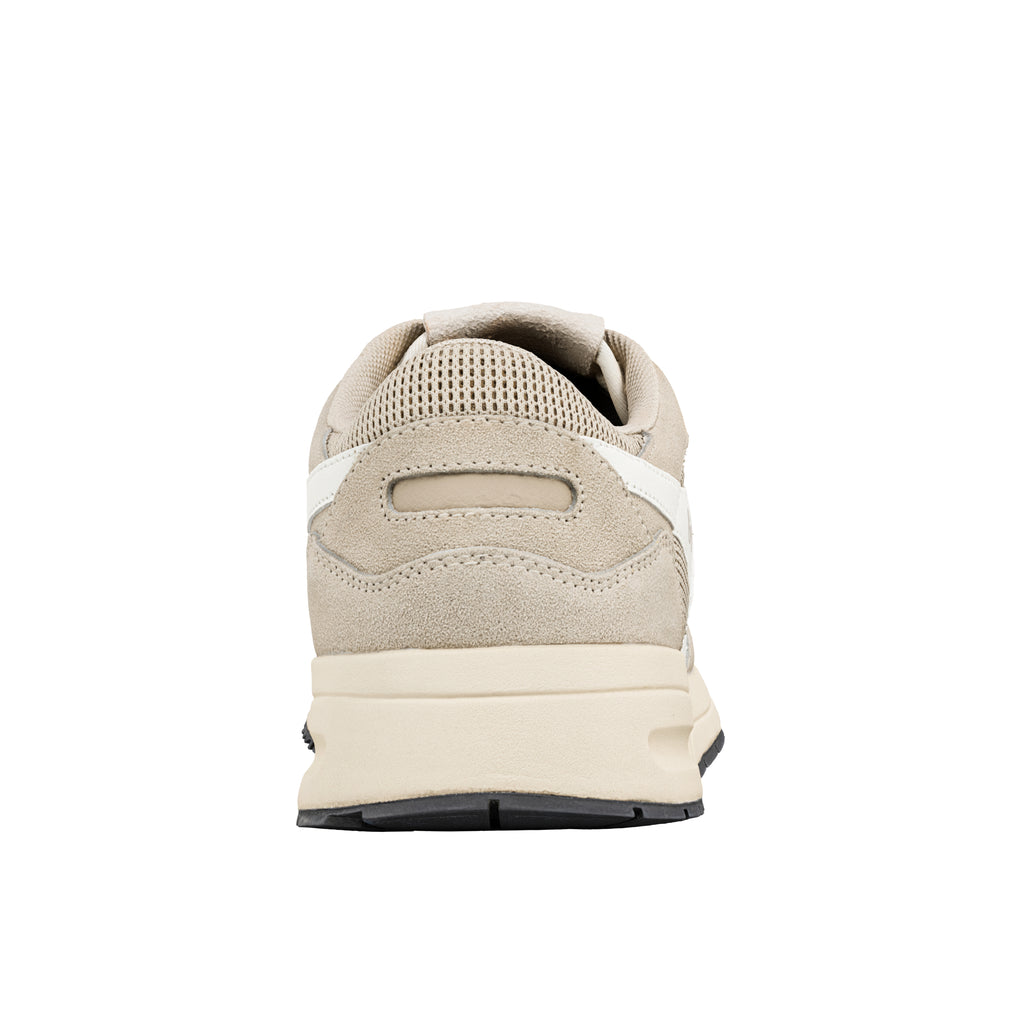 Rear view of a beige suede trainer with a cream midsole and black rubber outsole