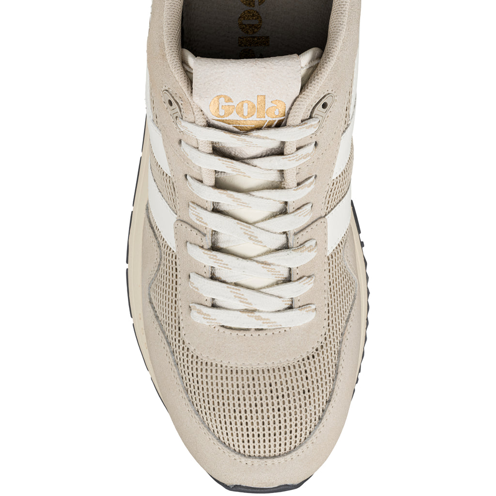 Top view of a beige Gola trainer with white laces and mesh detailing