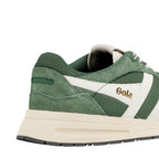 Close up of the heel and side of a green and cream Gola trainer