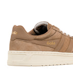 Close up of a tan suede Gola trainer with a cream rubber sole