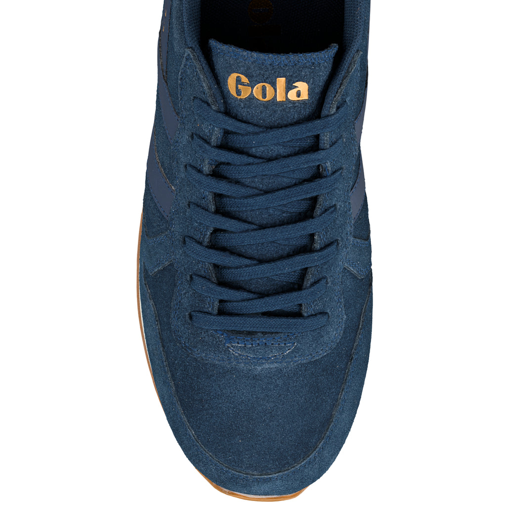 Top view of a navy blue suede Gola trainer with matching laces and gold branding on the tongue