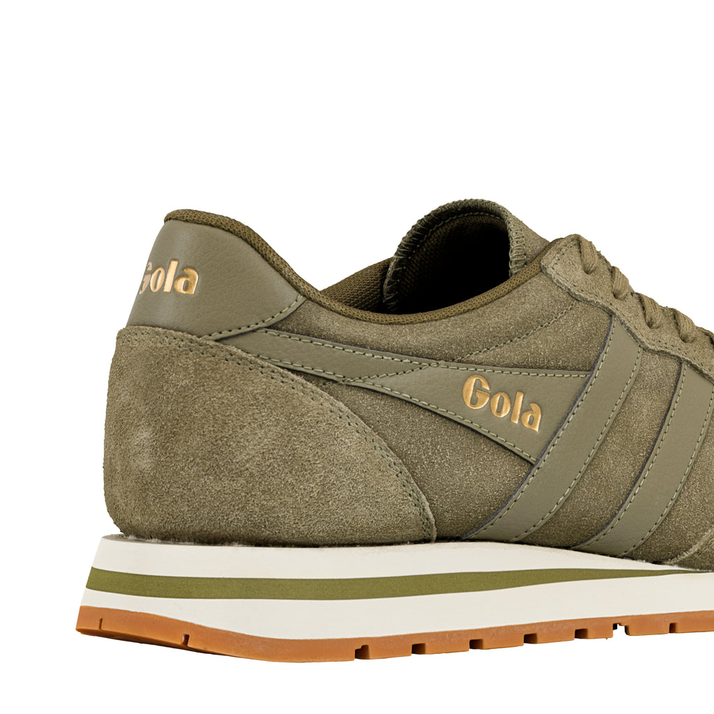 Olive green suede Gola trainer with gold branding and white and gum rubber sole
