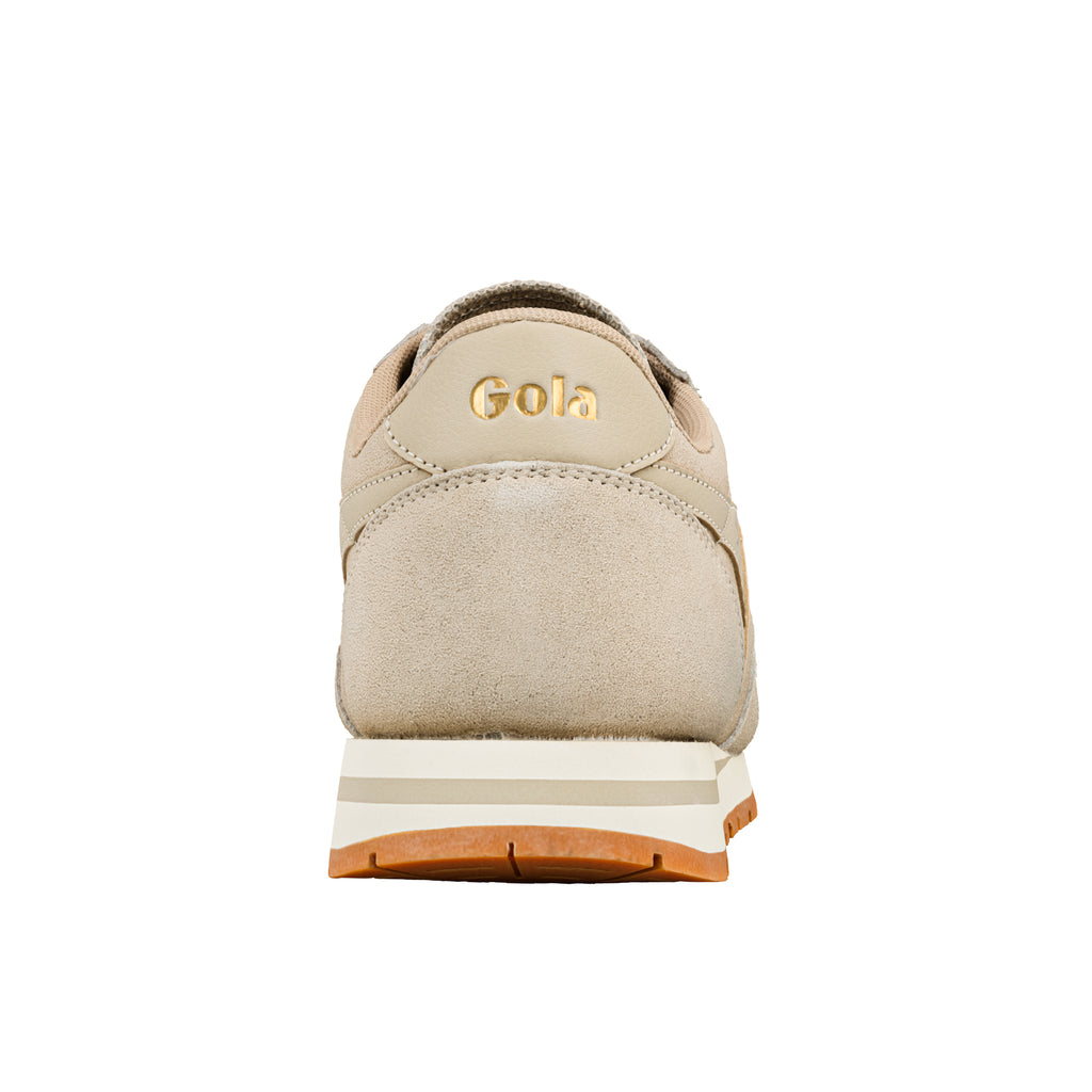 Rear view of a beige Gola trainer with a gum rubber sole