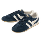 Navy blue suede trainers with white side stripes and gum soles