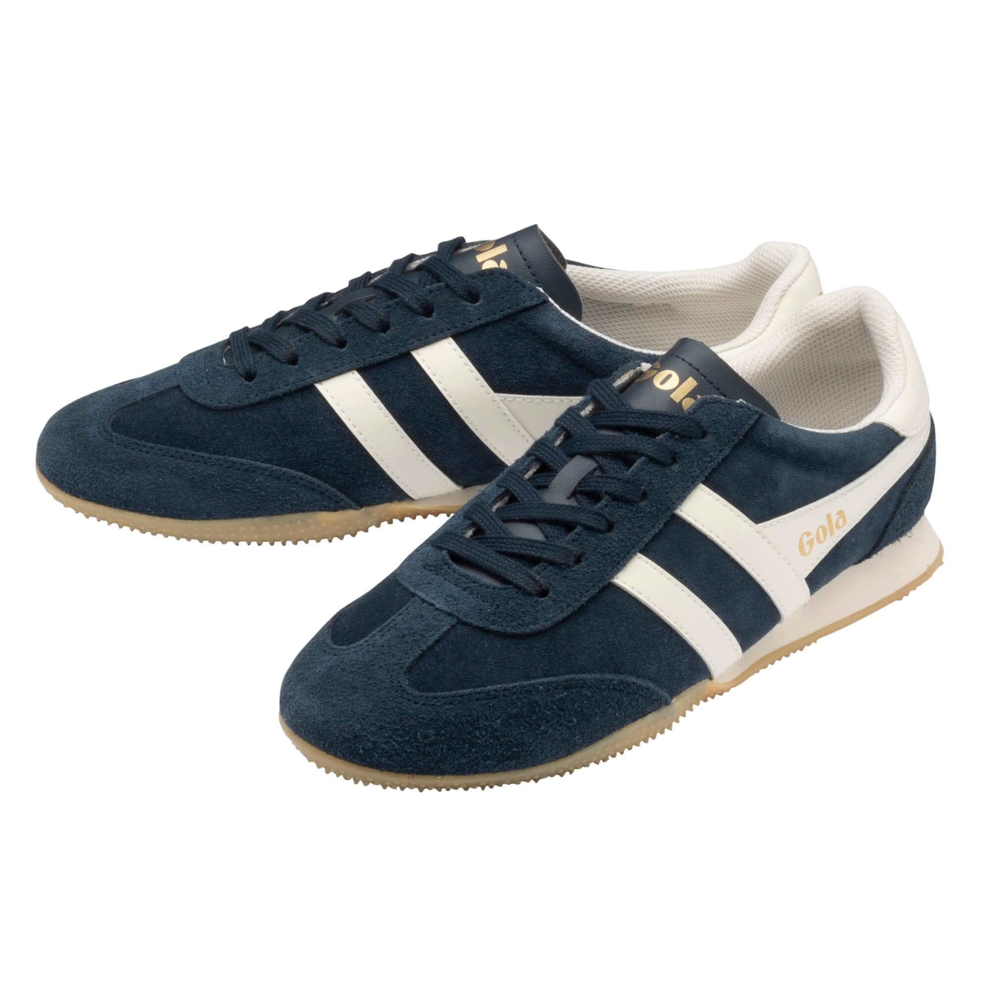 Navy blue suede trainers with white side stripes and gum soles