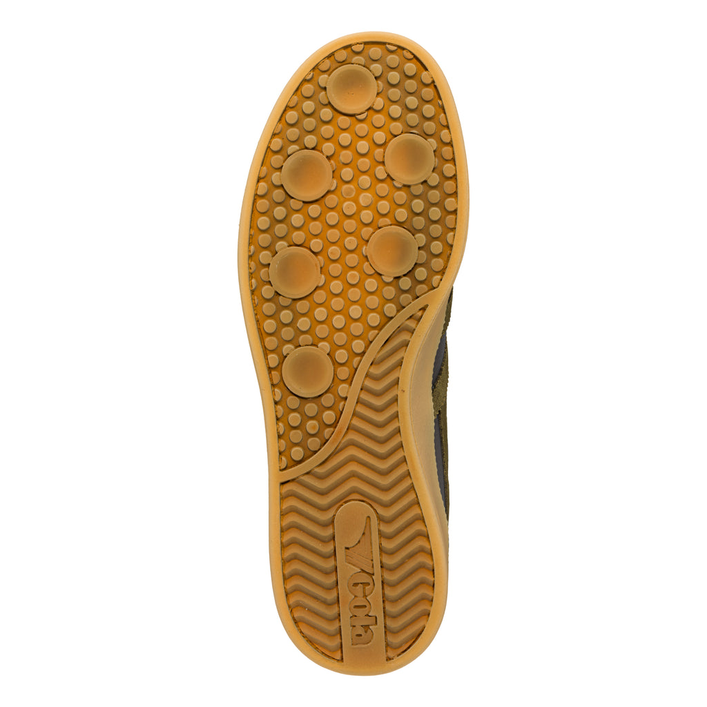 Gum rubber trainer sole with circular tread pattern and Gola branding