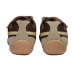 Pair of brown and beige trainers, rear view