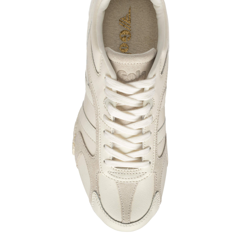Top-down view of a single Gola trainer in off-white with suede and leather panels