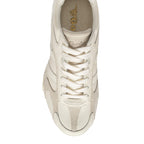 Top-down view of a single Gola trainer in off-white with suede and leather panels
