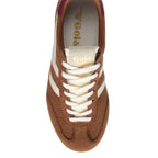 Top-down view of a brown suede Gola trainer with white stripes and laces