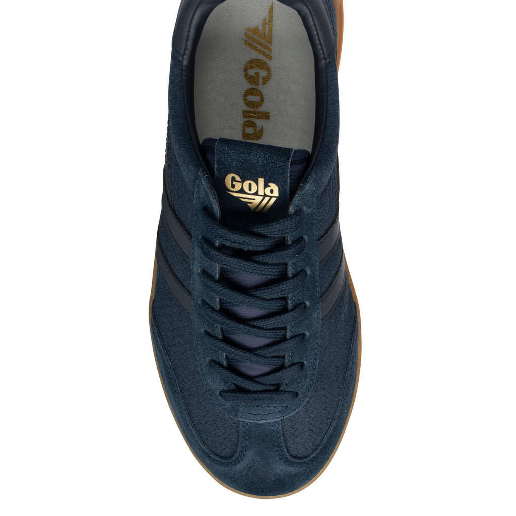 Navy Gola trainer with gold branding and a gum sole