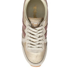 Overhead view of a Gola trainer in gold and pink with cream laces