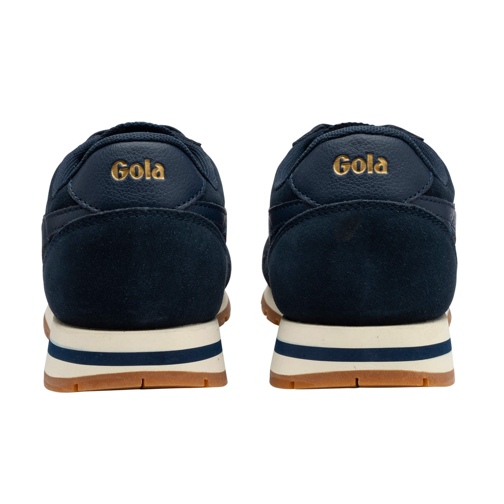 Rear view of two navy Gola trainers with gold Gola branding on the heel, white midsole, and brown sole