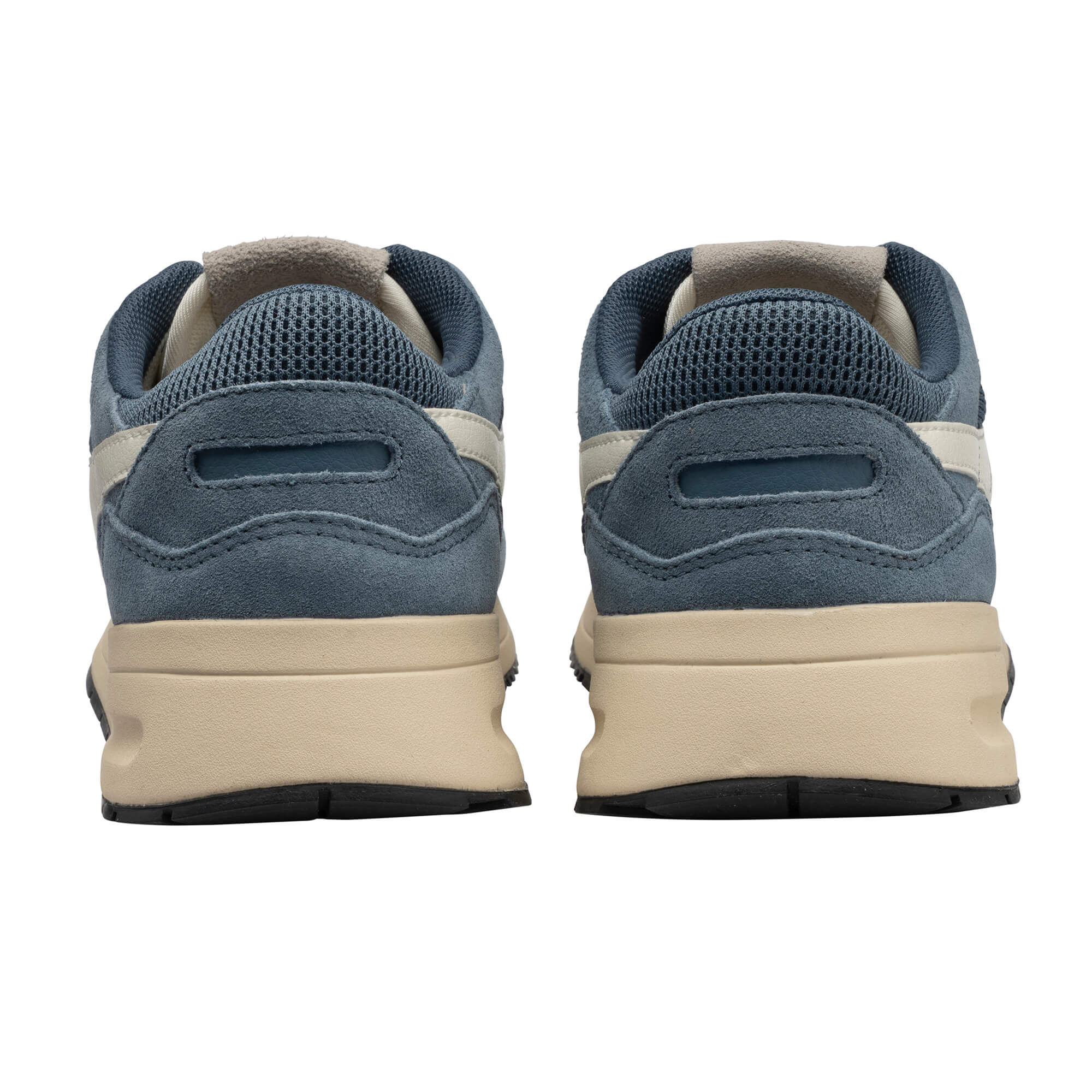 Pair of blue suede trainers with beige soles, rear view