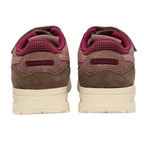 Rear view of two brown and burgundy trainers with cream soles