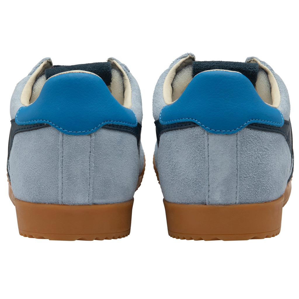 Pair of blue trainers with brown soles on a white background