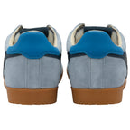 Pair of blue trainers with brown soles on a white background