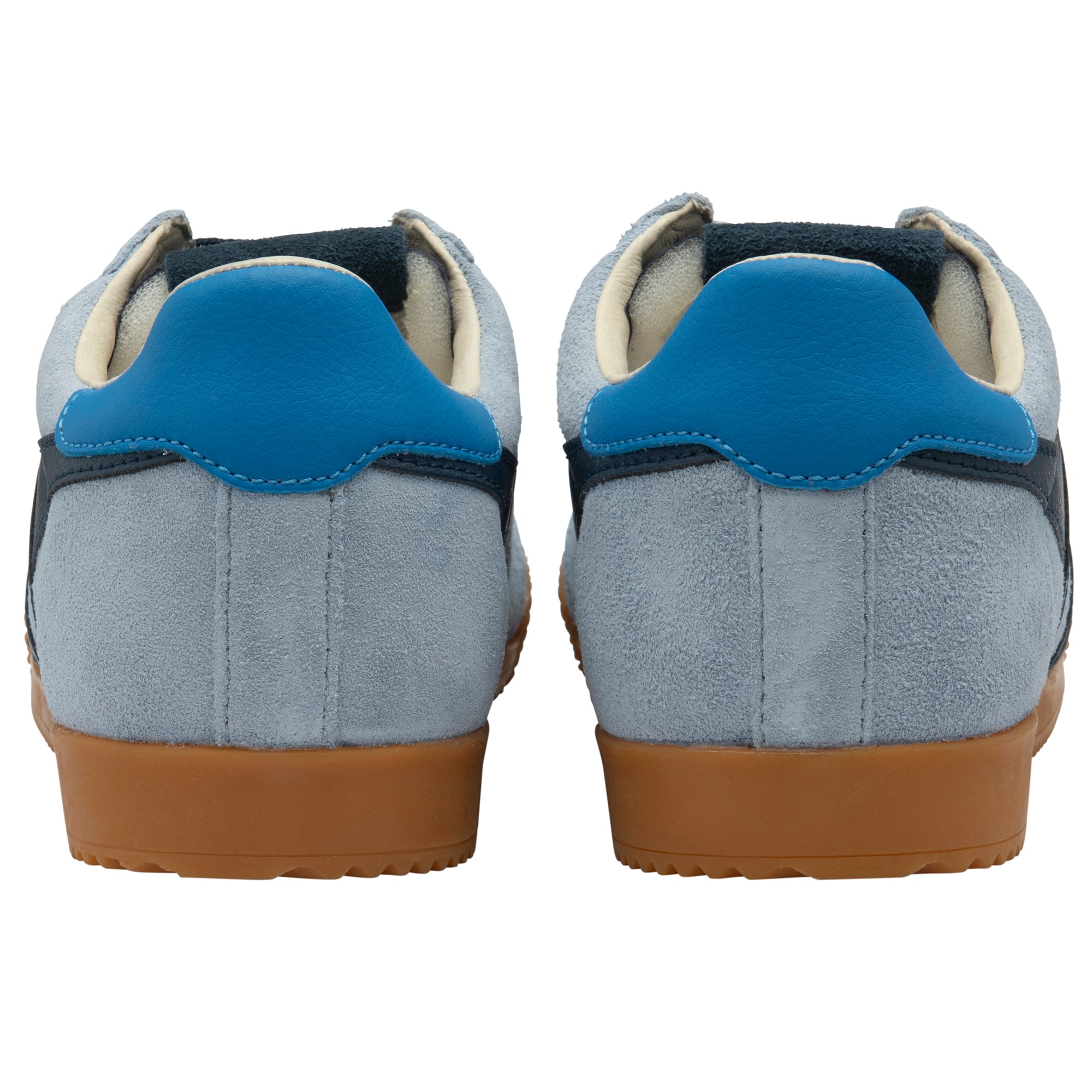 Pair of blue trainers with brown soles on a white background