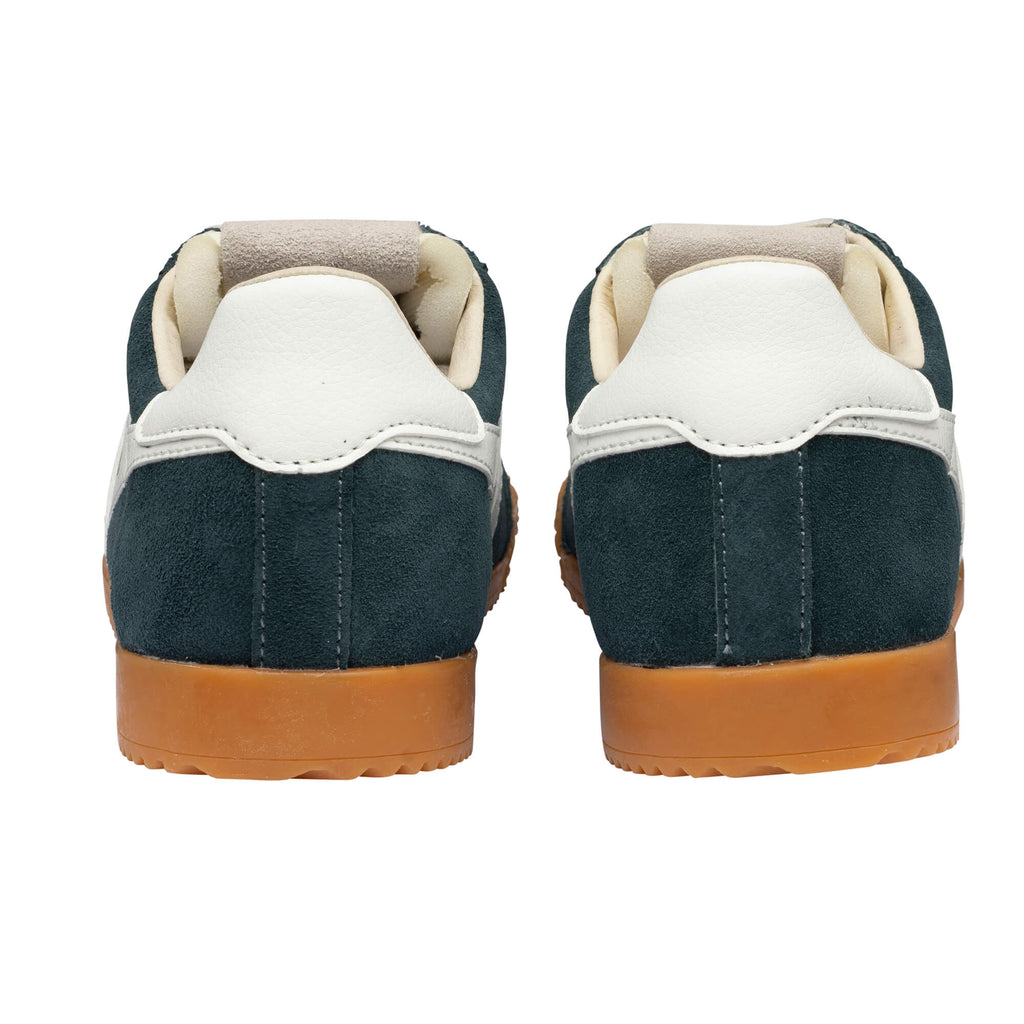 Pair of dark green suede trainers with white leather heel tabs and tan rubber soles, rear view