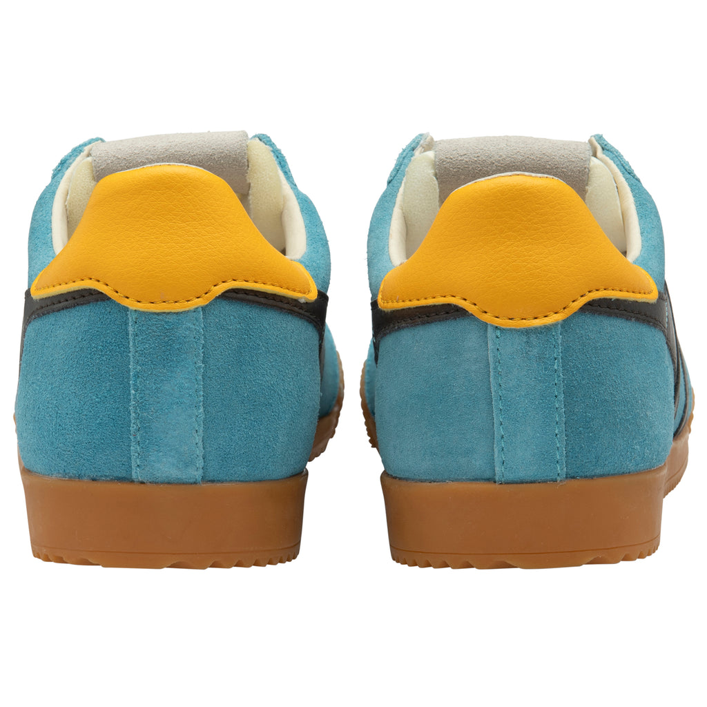 Pair of blue trainers with yellow accents on a white background