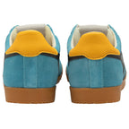 Pair of blue trainers with yellow accents on a white background