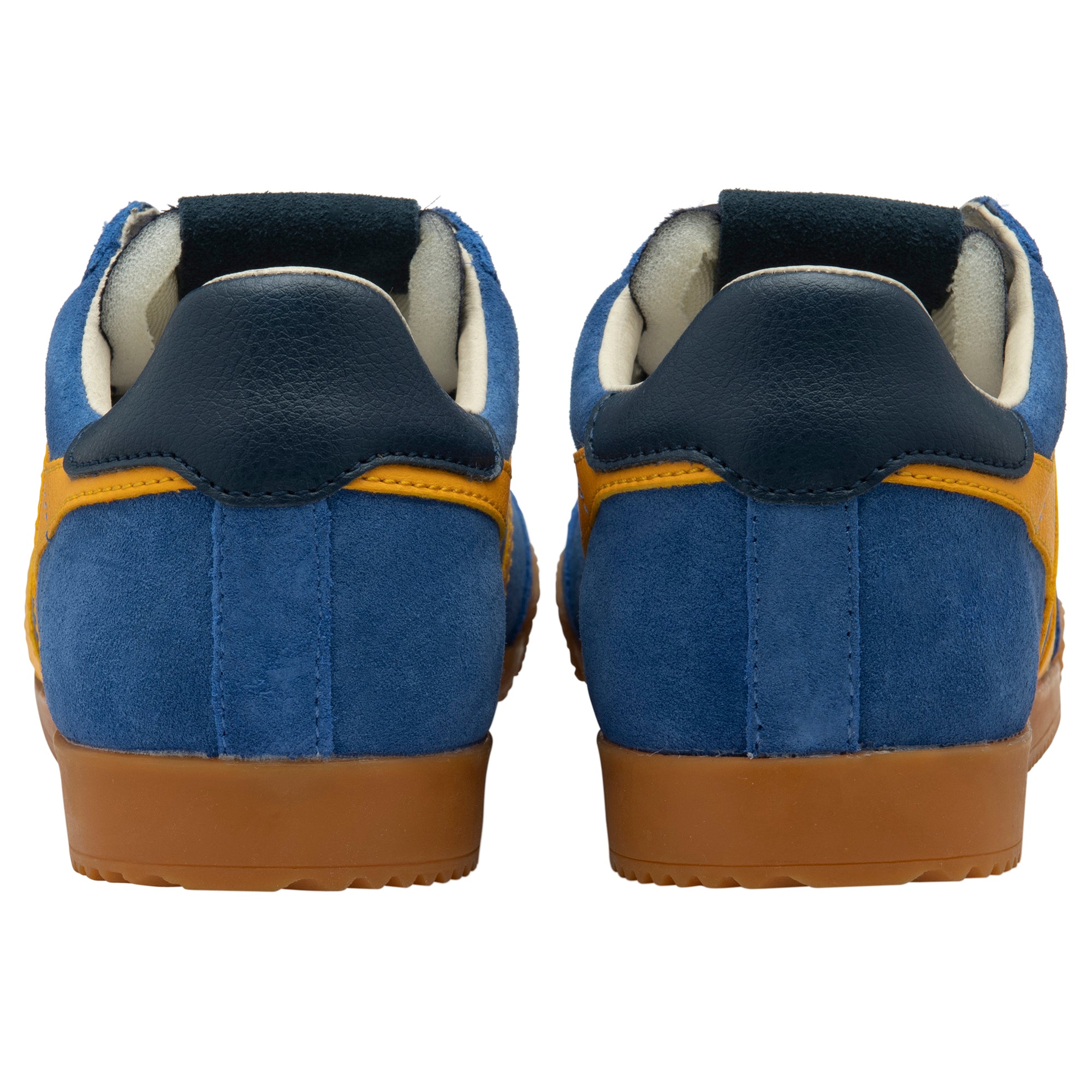 Blue and yellow trainers with brown soles on a white background