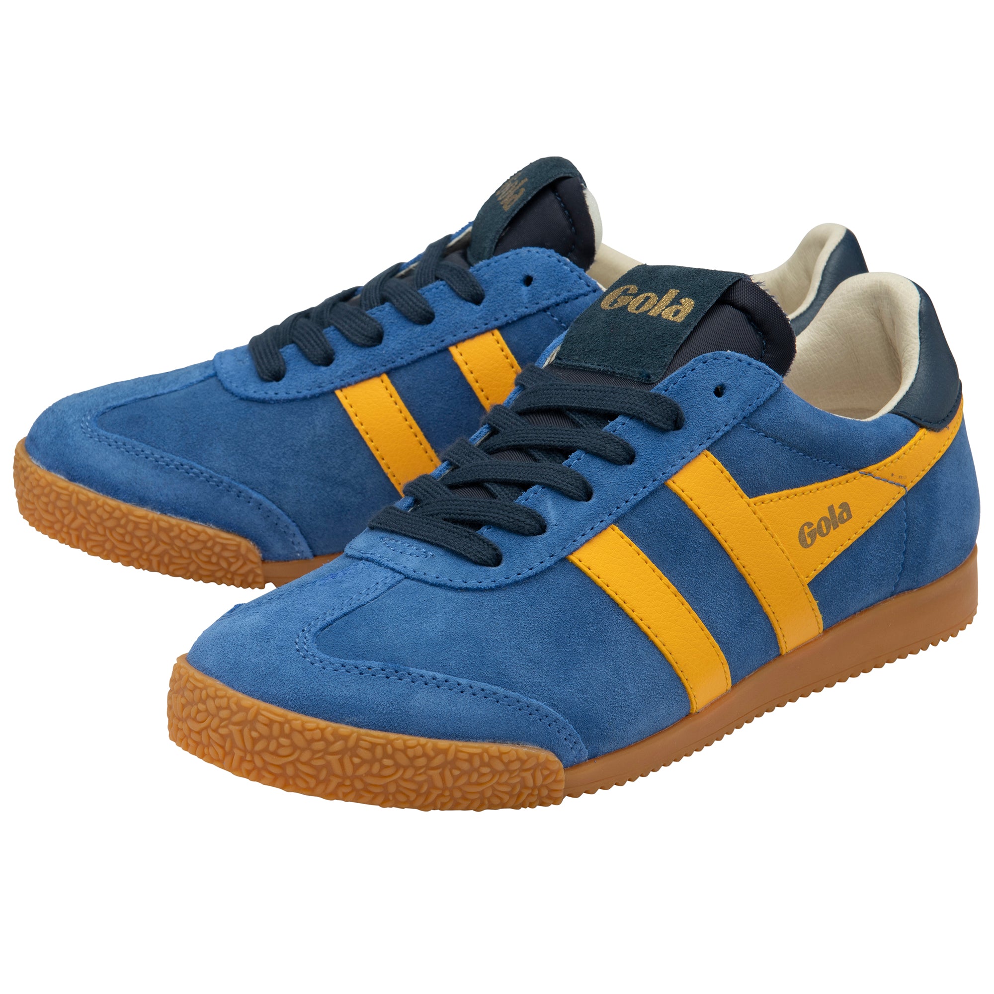 Blue and yellow trainers with brown soles on a white background