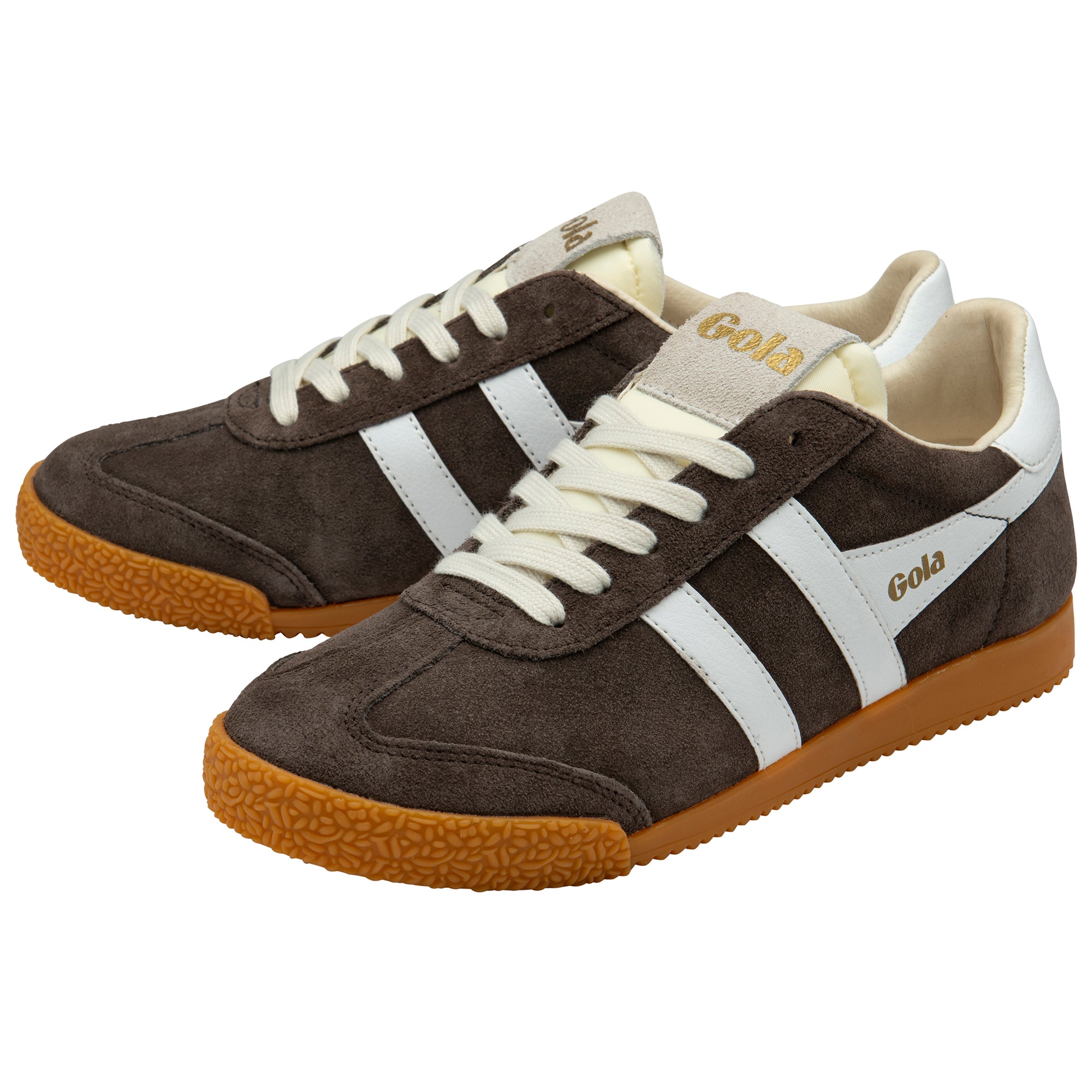 Pair of brown trainers with white laces and soles on a white background