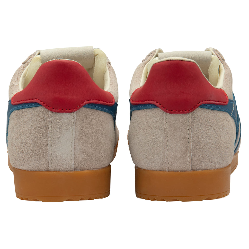 Pair of beige trainers with red and blue accents on a white background