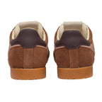 Pair of brown suede trainers with dark brown heel tabs and tan soles, rear view