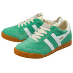 Green trainers with white laces and brown soles on a white background