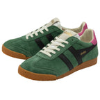 Green trainers with black stripes and brown soles on a white background