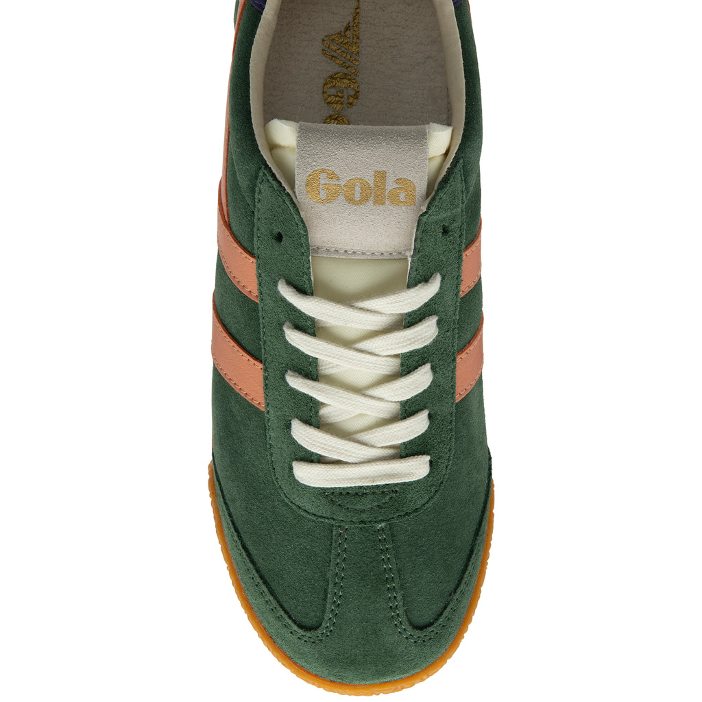Green trainer with white laces and brown accents on a white background