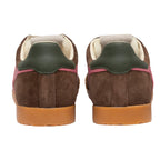 Pair of brown suede trainers with green heel tabs and pink accents, rear view