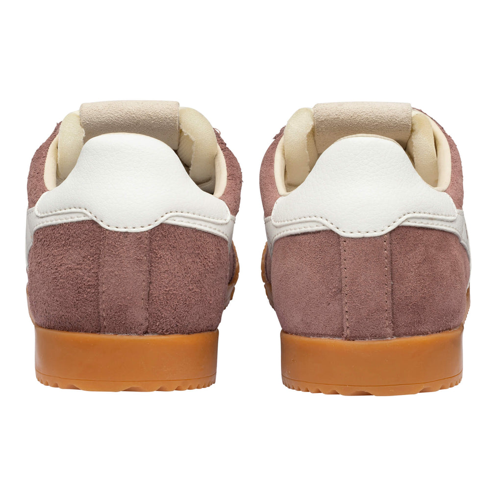 Rear view of two brown suede trainers with white heel tabs and tan gum soles