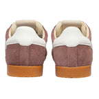 Rear view of two brown suede trainers with white heel tabs and tan gum soles