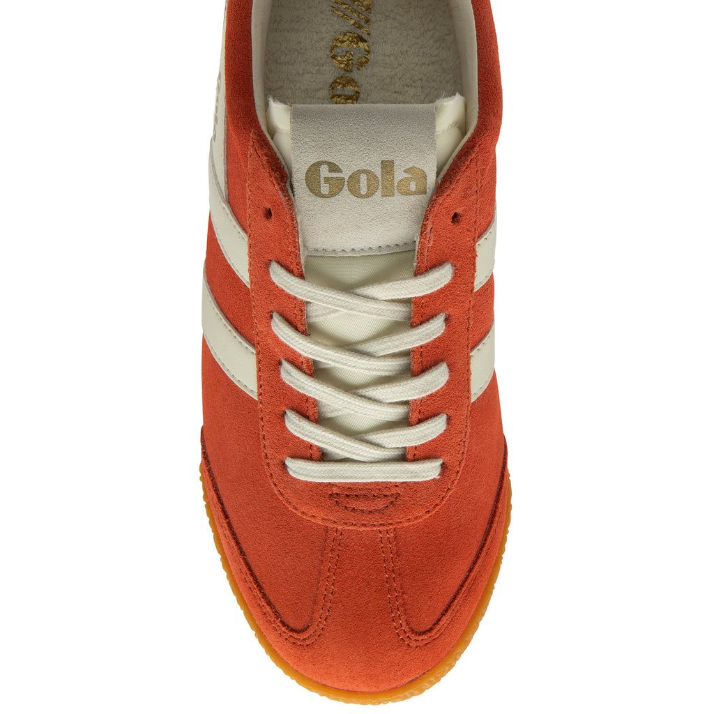 Orange trainer with white laces on a white background