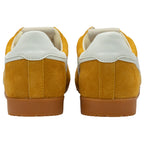 Pair of yellow trainers with white soles on a white background
