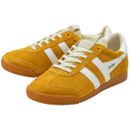 Pair of yellow trainers with white laces and brown soles on a white background