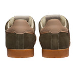 Rear view of two khaki suede trainers with tan leather accents and brown rubber soles