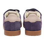 Pair of purple suede trainers with beige heels and brown soles