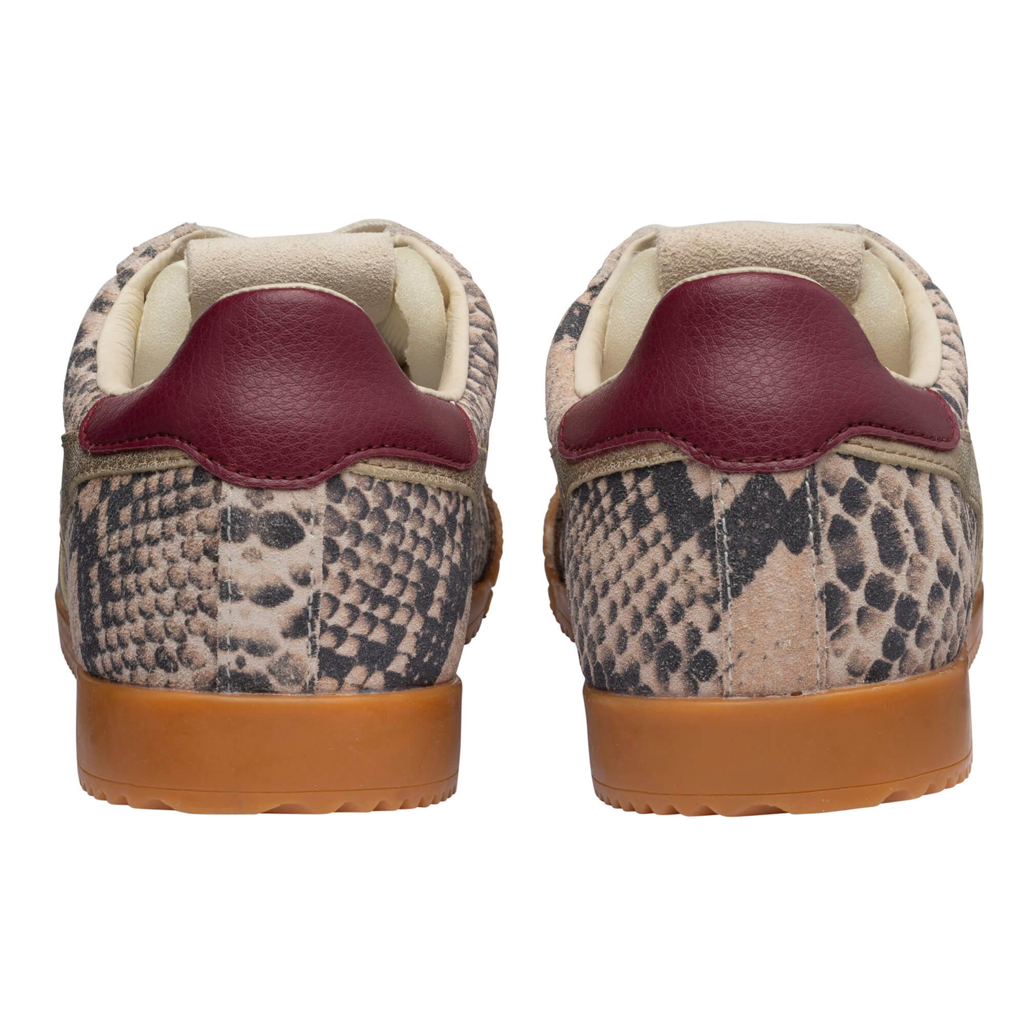 Rear view of two trainers with snakeskin print, burgundy heel tabs, and tan soles