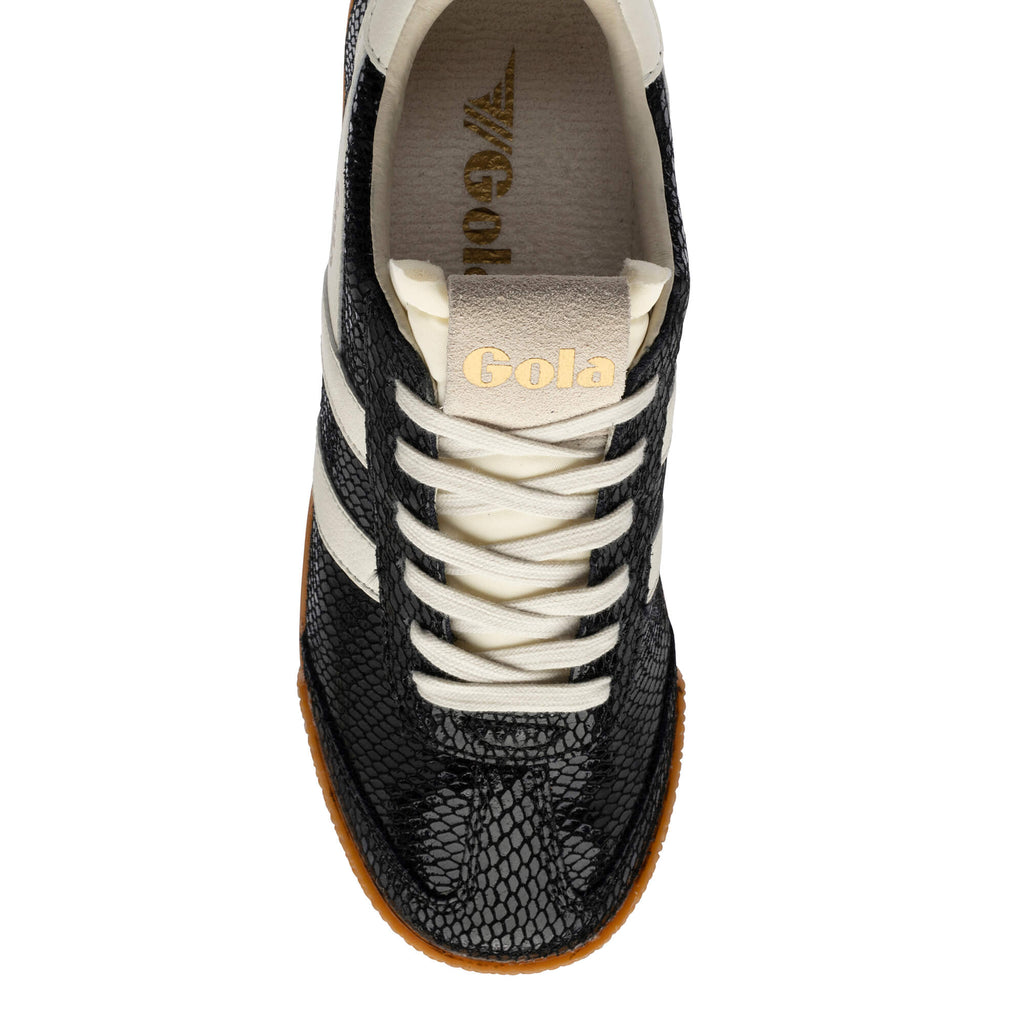 Black and white Gola trainer with snakeskin texture and gum sole
