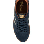 Navy blue Gola trainer with brown trim and gold Gola logo on the tongue