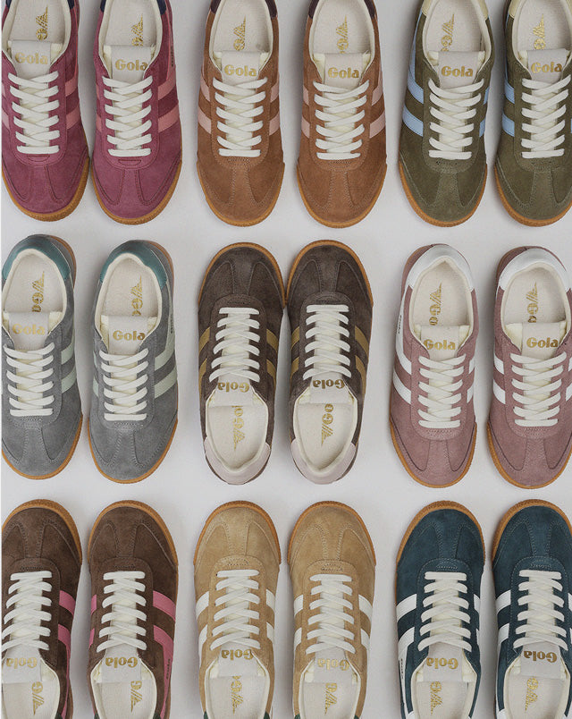 Top view of eighteen Gola suede trainers in various colours arranged in a grid
