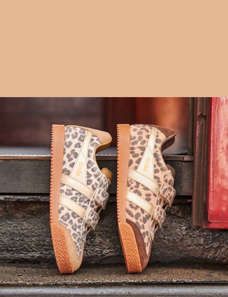 Pair of Gola Harrier trainers in animal print with gold stripes and brown soles