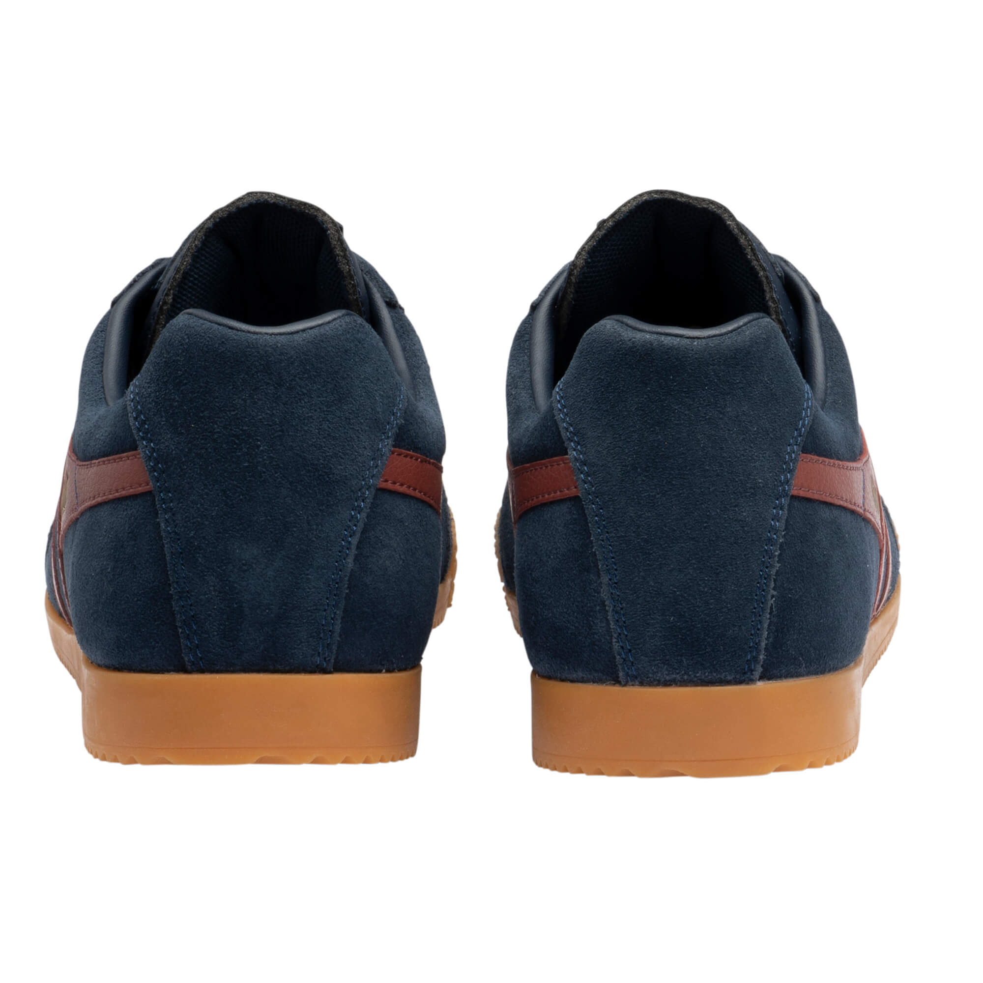 Rear view of two navy blue suede trainers with brown stripes and gum soles